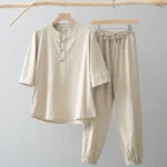 Men's Buddhist meditation suit with three-quarter sleeve shirt and jogger pants in khaki beige, featuring traditional frog button closure and stand collar, front flat hanging view