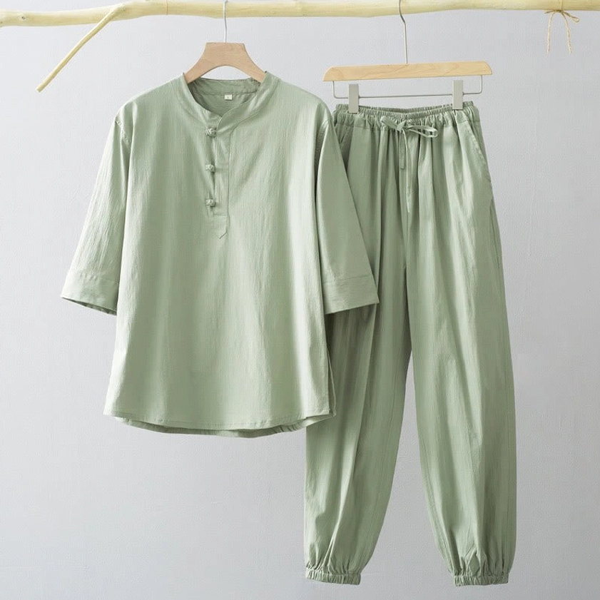 Light sage green men's Buddhist meditation clothing with stand collar, frog button top, and tapered drawstring pants for yoga tai chi practice