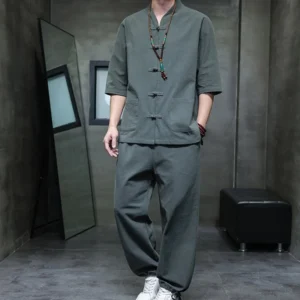 Men's Buddhist meditation cotton linen tang suit set in dark gray-green, front full-body view with stand collar and frog buttons