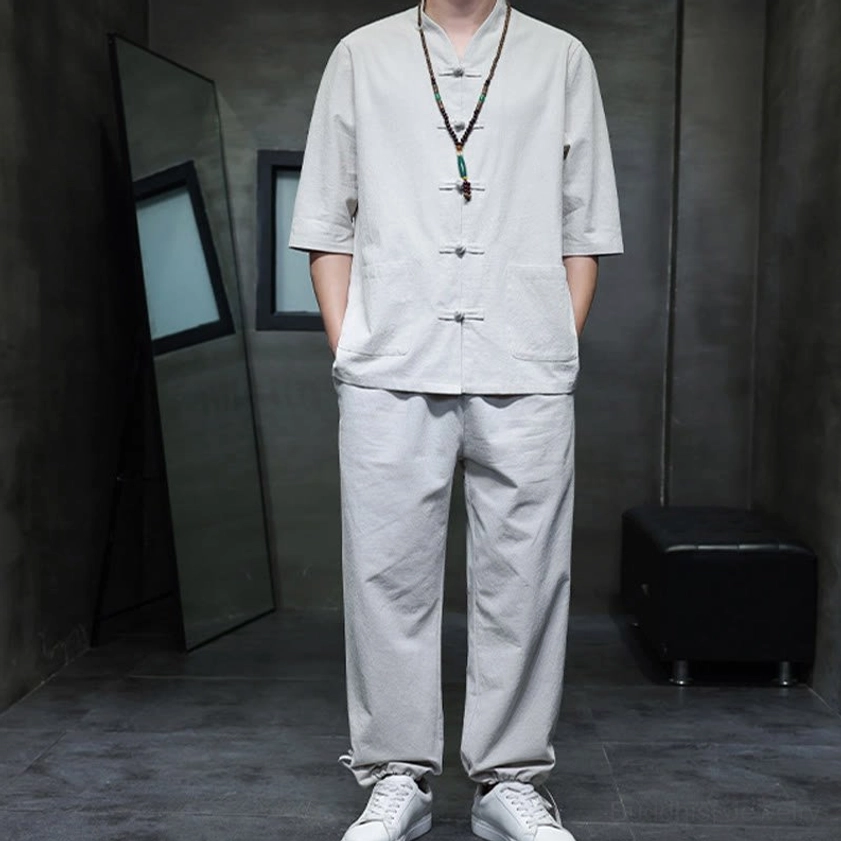 Men's Buddhist meditation cotton linen tang suit set showcasing half-sleeve and frog button construction