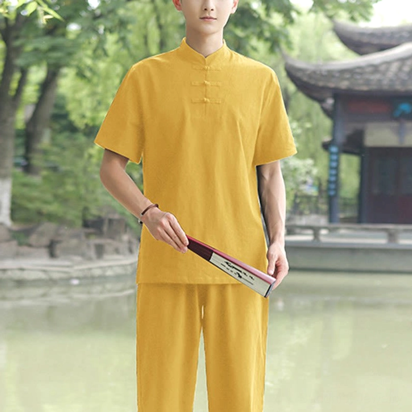 Men's yellow Tai Chi meditation 2-piece set with relaxed fit and traditional stand collar by lakeside