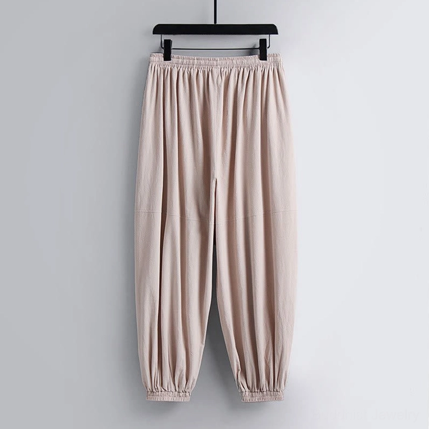 Single pair of loose-fitting cropped harem pants with elasticated waist – front hanging detail