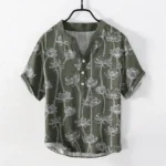 Men's navy blue lotus henley shirt front view with white line art floral print, half button stand collar, short sleeves