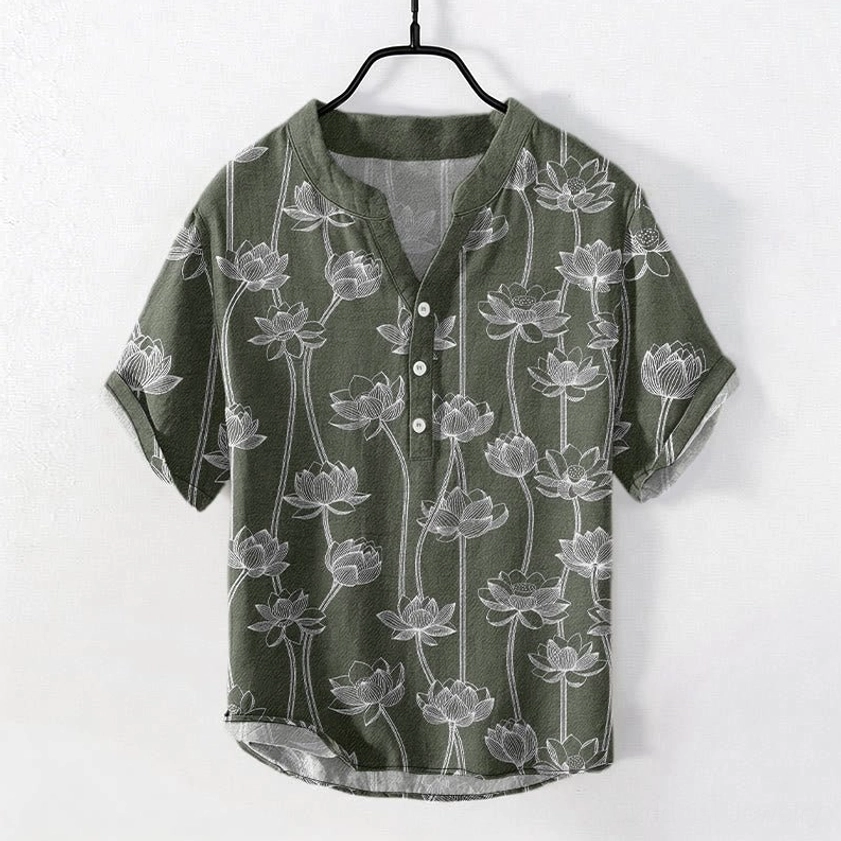 Men's navy blue lotus henley shirt front view with white line art floral print, half button stand collar, short sleeves
