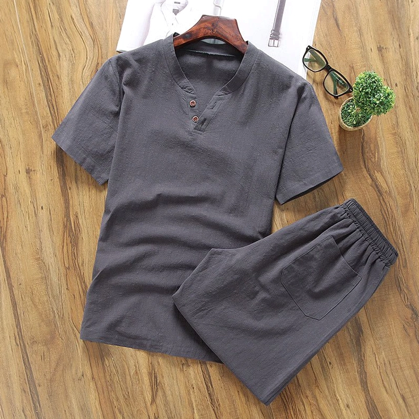 Dark grey men's meditation henley and shorts set minimalist flat lay view