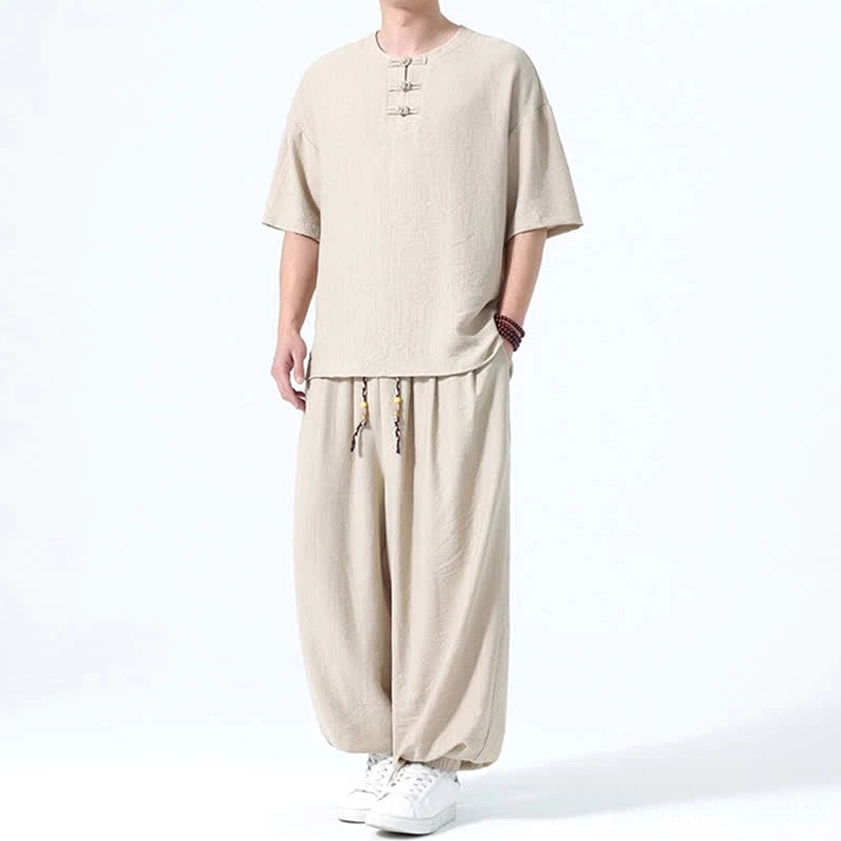 Men's Eastern philosophy inspired set wheat front raised hand casual relaxed pose