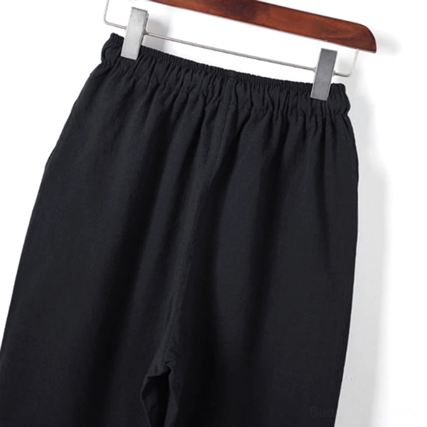 Side detail of meditation pants waist showing soft woven cotton fabric and elastic waist construction