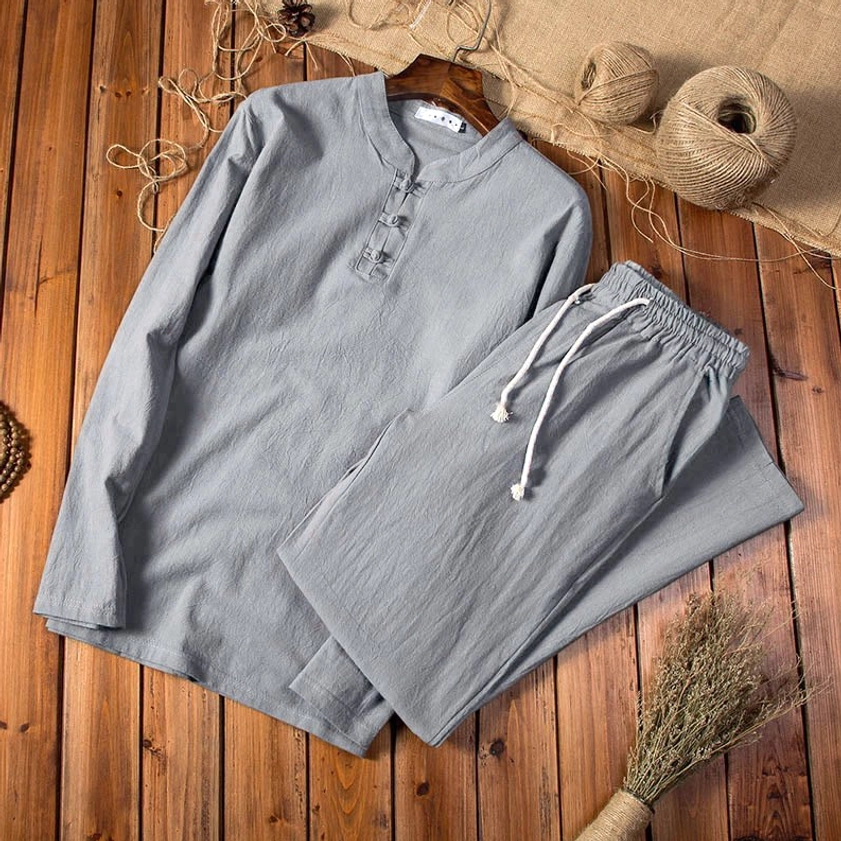 Back view of midnight blue men's linen meditation set showcasing long sleeve top and relaxed pants fit