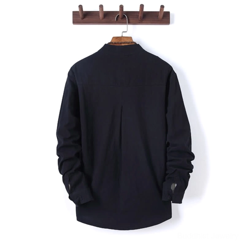 Zen meditation shirt back view showing pleated design and curved hem, long sleeve cotton fabric hanging on wooden hanger