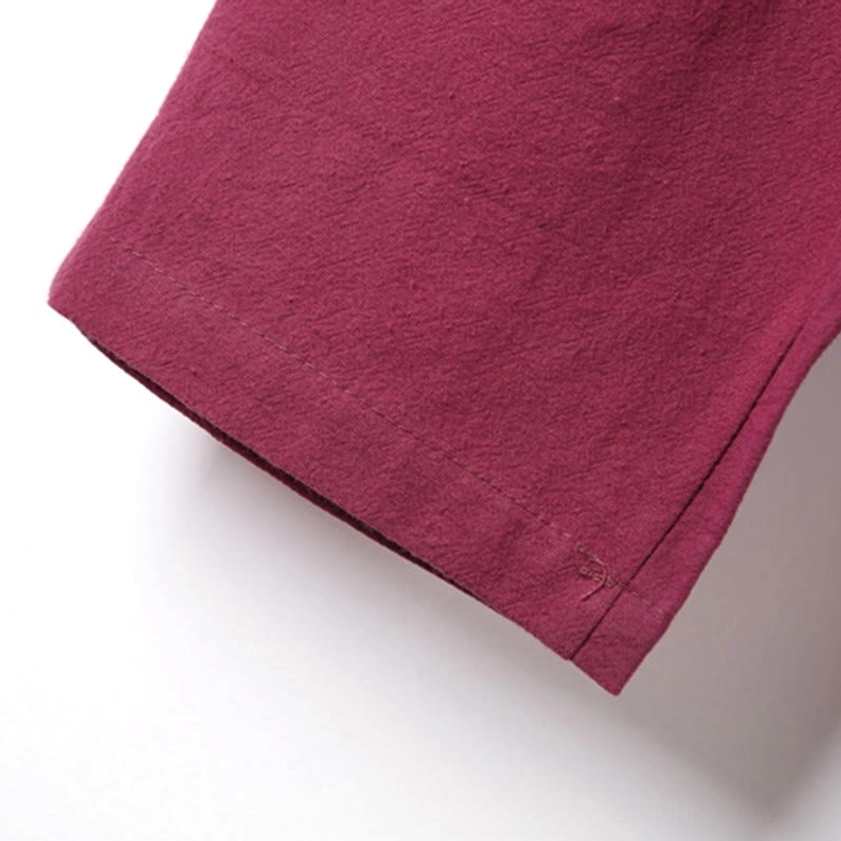 Close-up of meditation shirt embroidery detail on chest showing decorative artisan craftsmanship
