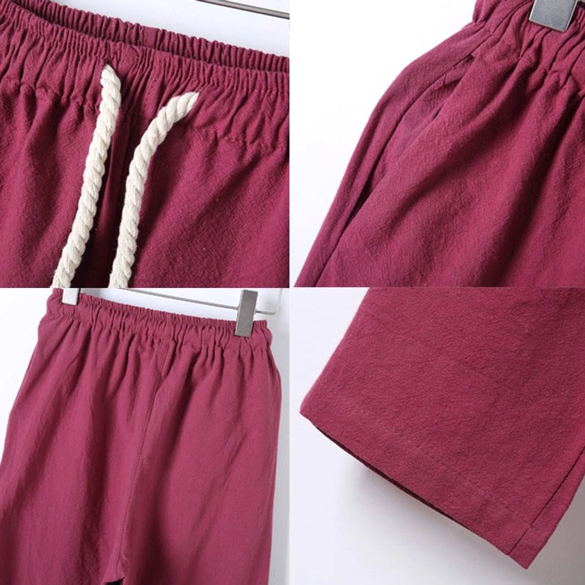 Back pleated detail of firebrick red meditation shirt showing traditional Eastern design construction
