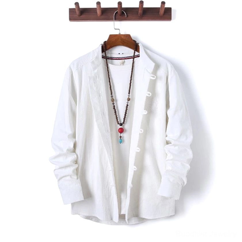 Royal blue mandarin collar meditation shirt with traditional frog buttons, front view on wooden hanger