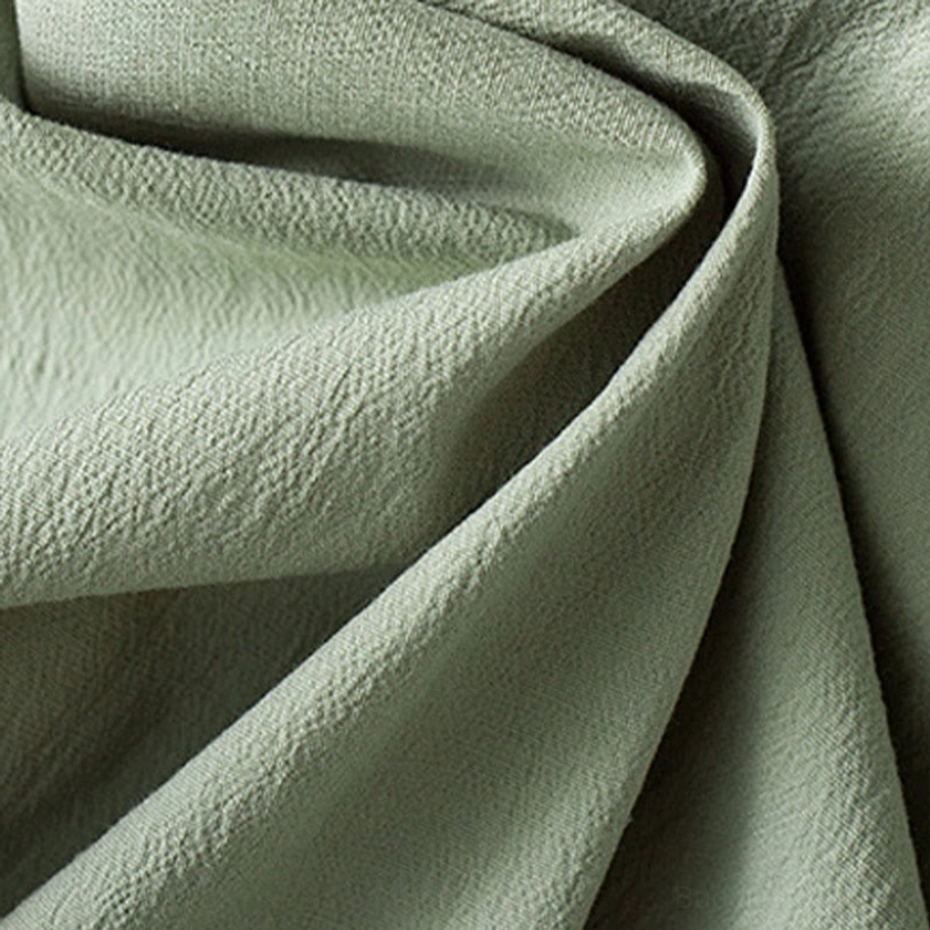 Men's Buddhist meditation suit fabric texture detail showing breathable natural cotton weave and traditional craftsmanship