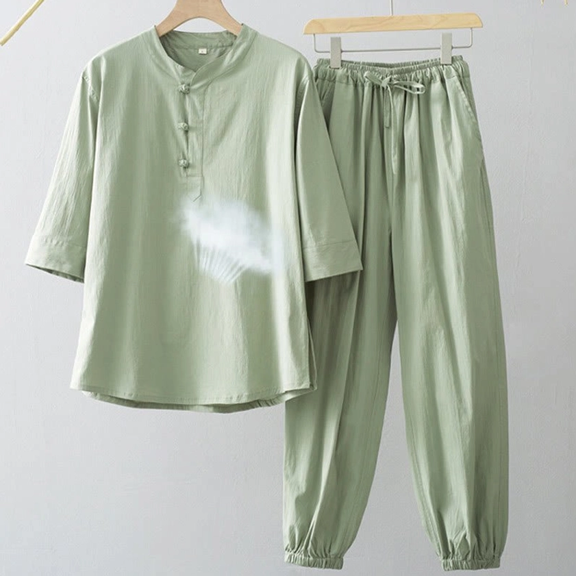 Light sage green men's Buddhist meditation suit with three-quarter sleeve shirt, frog button closure, drawstring tapered jogger pants