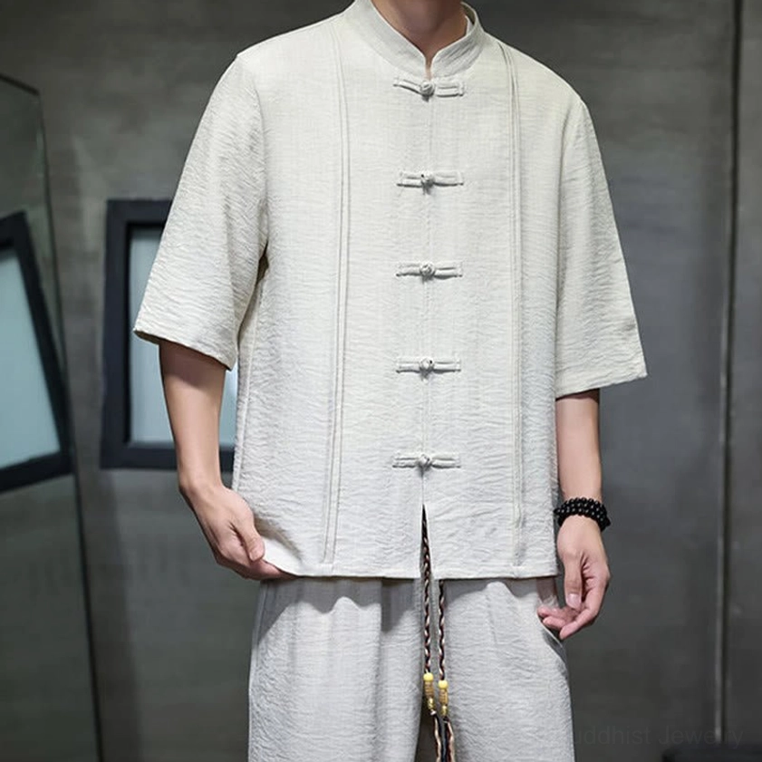 Detail view of men's meditation clothing with visible tassel drawstring and pocket design