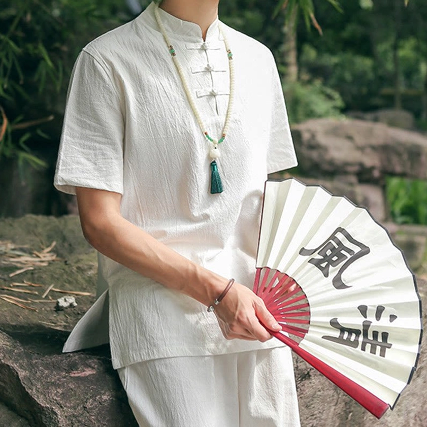 Men's white Zen meditation cotton linen set half-body view with stand collar in garden