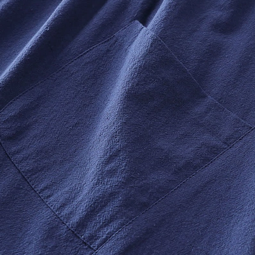 Men's Tang style meditation top detail showing frog button closure and traditional collar