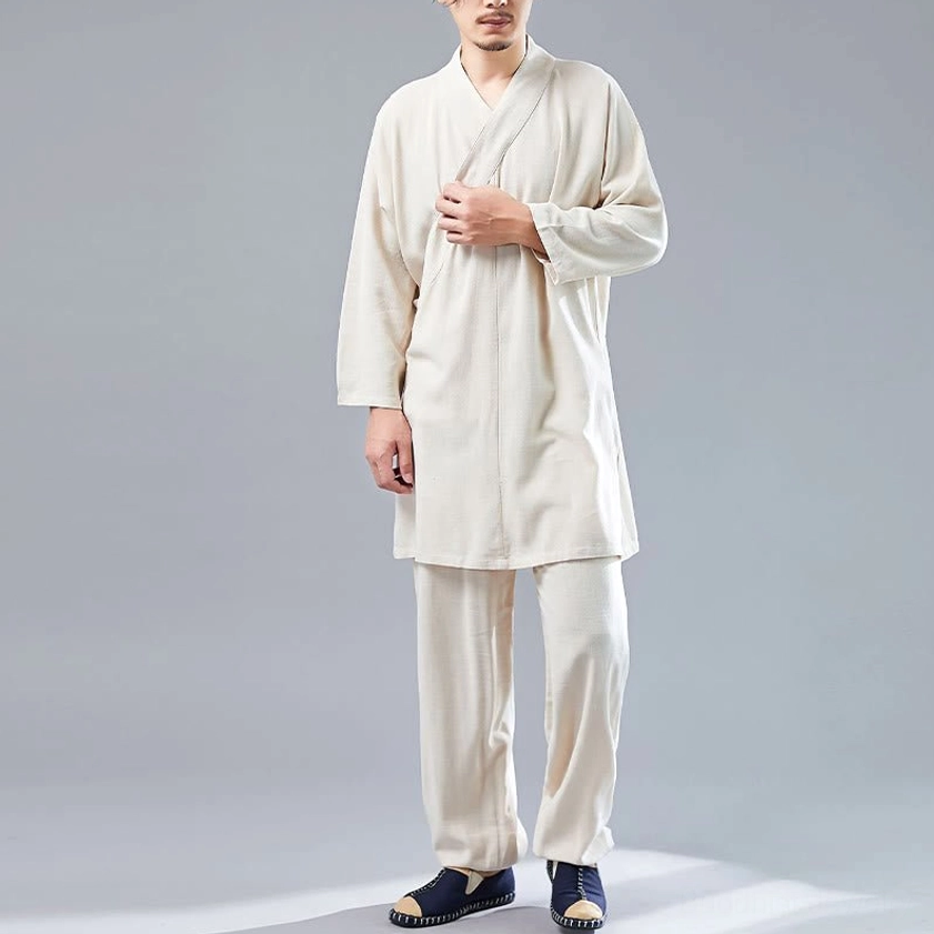 Detail shot of beige cotton-linen meditation uniform fabric texture and V-neck construction