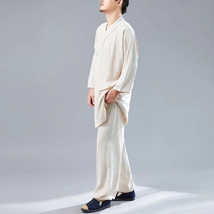 Three-quarter view of beige Buddhist meditation clothing showing asymmetrical collar and drape