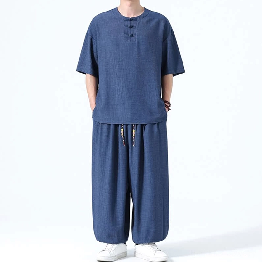 Men's Eastern philosophy inspired set navy front raised hand relaxed casual posture