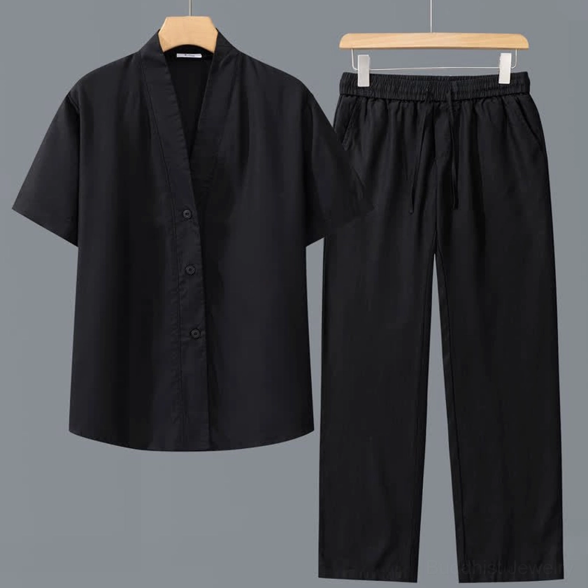 Pure black men's minimalist meditation clothing set with V-neck shirt and straight leg drawstring pants flat lay