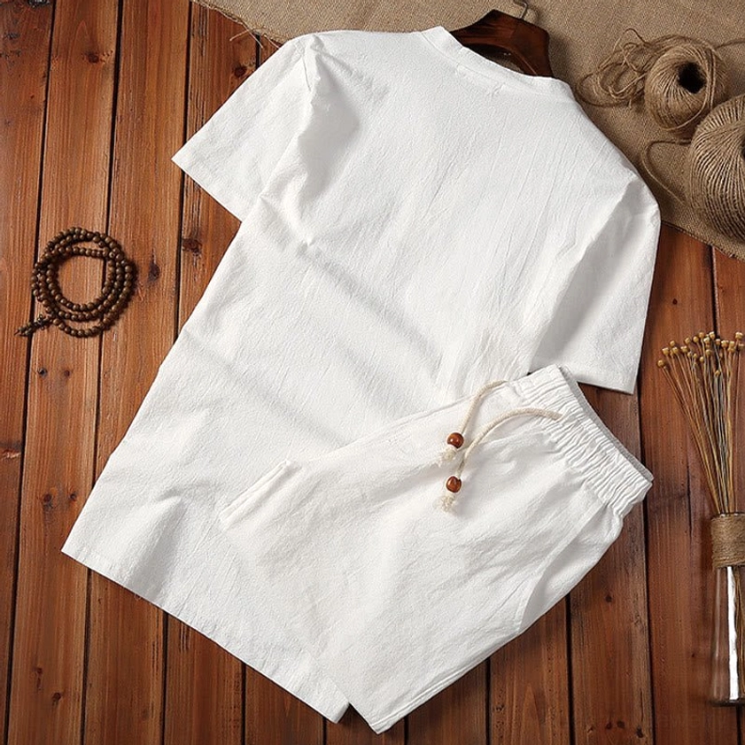 Off-white men's solid color crew neck meditation tee and shorts set, overhead flat lay display