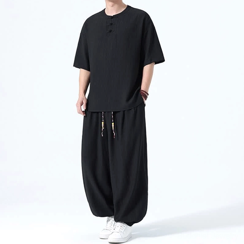 Men's Buddhist meditation wear black front full body raised hand showing comfortable silhouette
