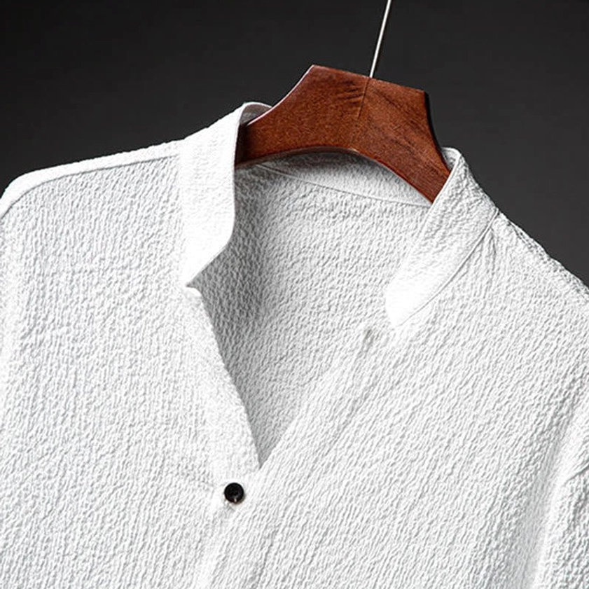 Men's white textured shirt and pants two-piece set, back view showing vented sleeves, straight leg pants with functional pockets