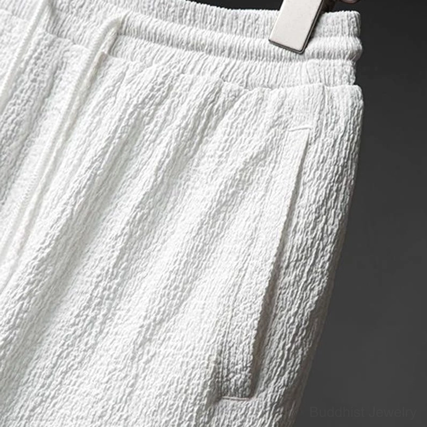 Detailed view of men's textured shirt collar, buttons, and front panel design showing traditional stand collar construction