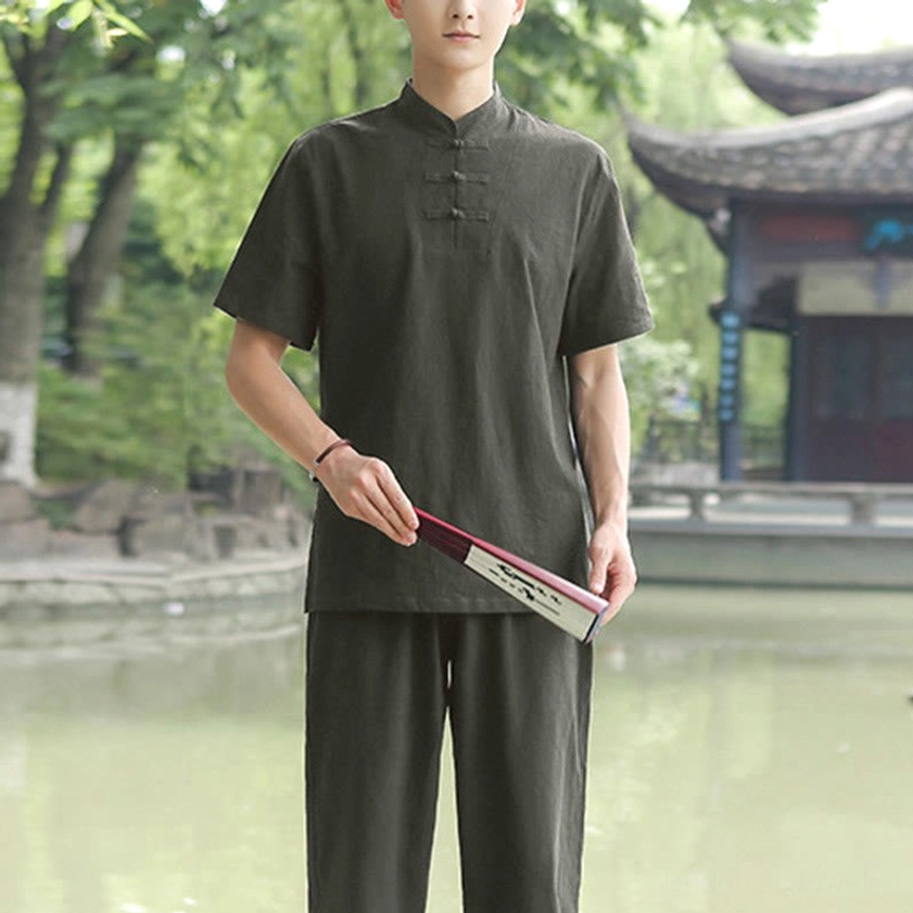 Men's dark green Tai Chi meditation top standalone in traditional Zen practice setting