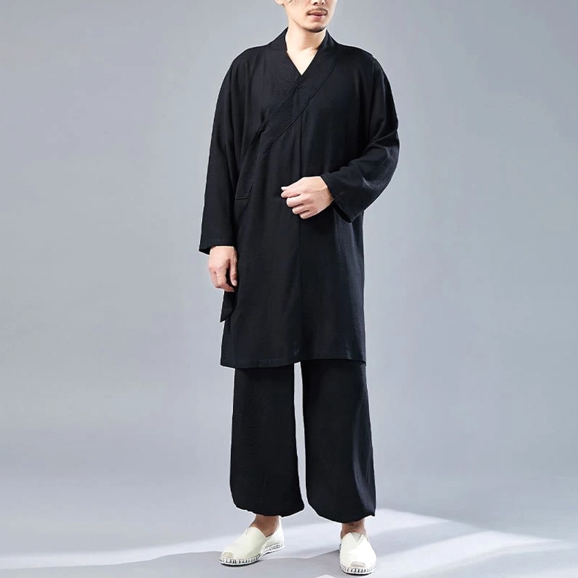 Man wearing black cotton-linen Buddhist meditation Tai Chi uniform in front full-body view