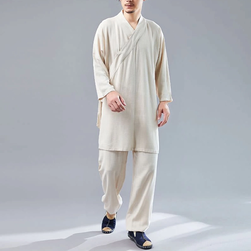 Man wearing beige linen Buddhist meditation clothing set with V-neck cross-collar design in front walking pose