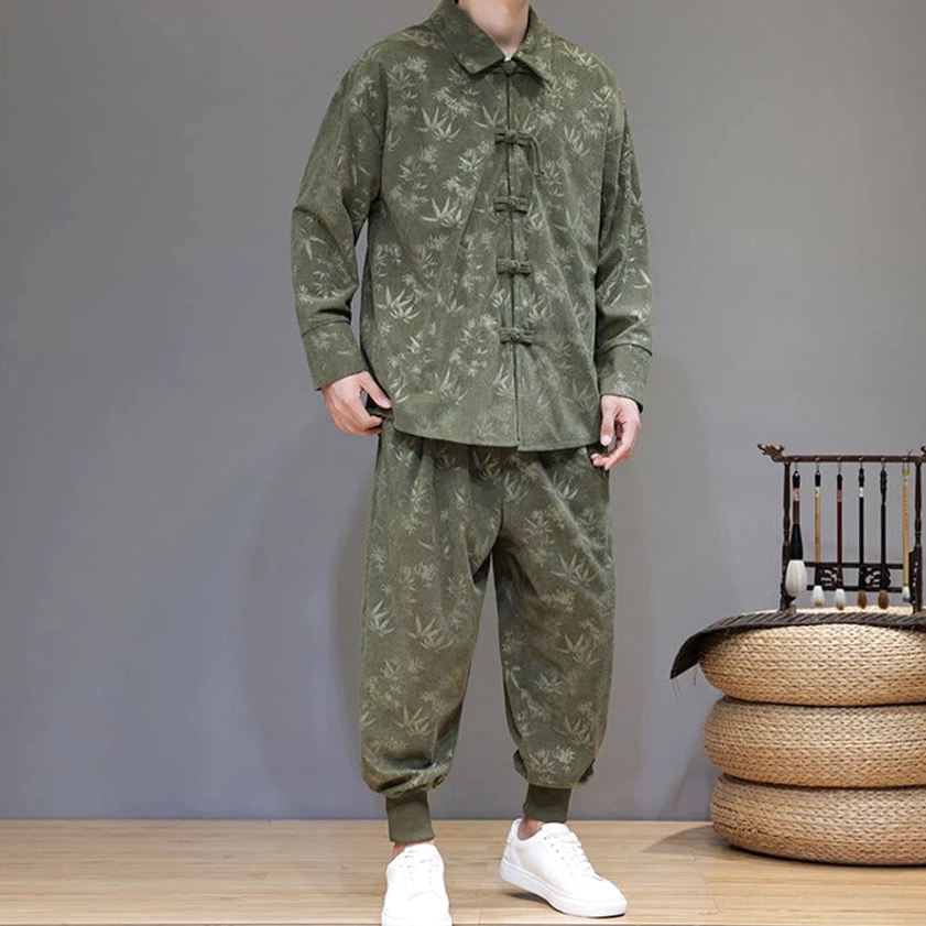 Authentic tang suit front-right three-quarter view with elastic cuffed pants and bamboo leaf print