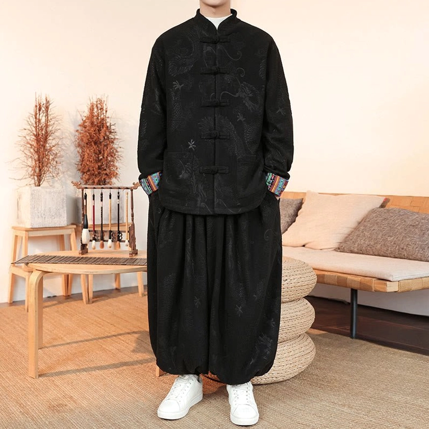 Black Tang suit with hidden dragon jacquard pattern, authentic frog button closures, full-body front angle