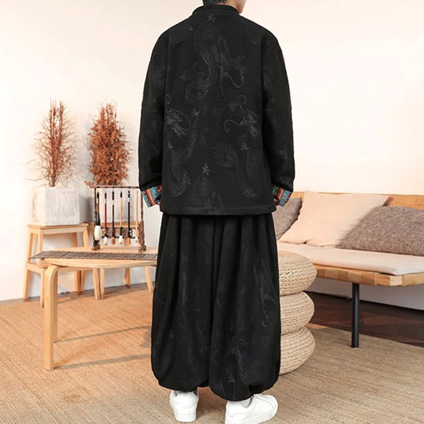 Men's Tang suit with white inner layer visible, hands in jacket pockets, contrast ethnic embroidered cuffs