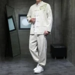 Men's Dragon Bamboo Tang Suit two-piece set with embroidered chest detail, front three-quarter view in off-white cotton