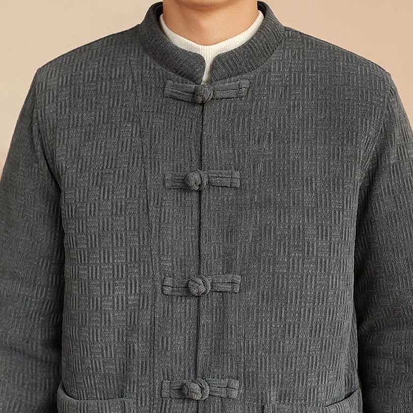 Men's traditional Tang suit jacket and pants two-piece set, detail view of frog button closure and craftsmanship