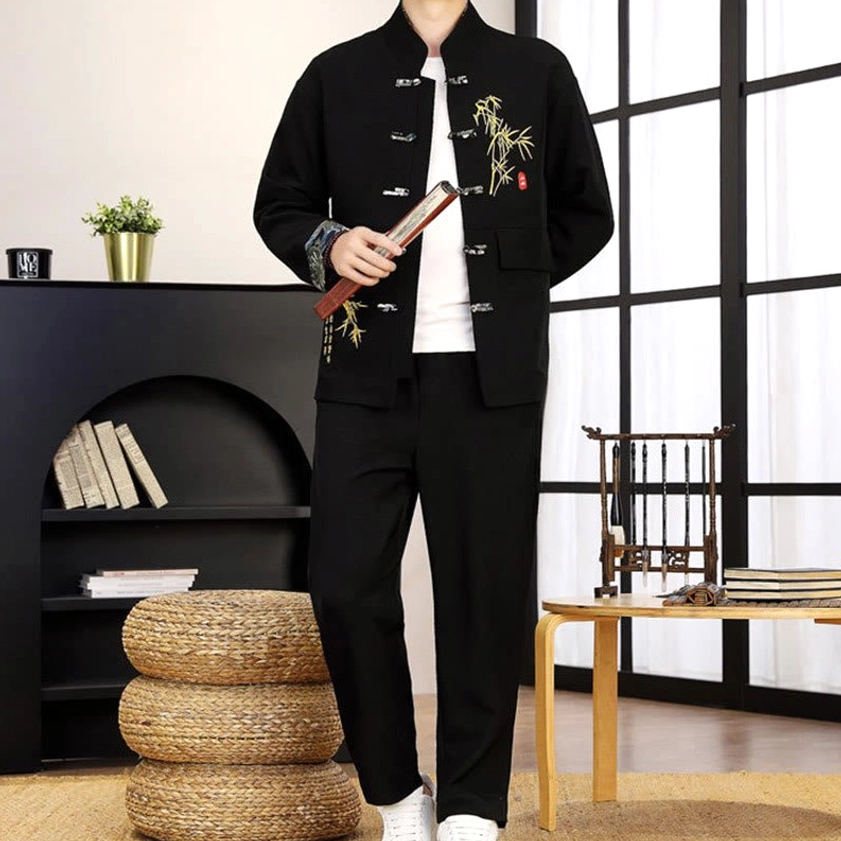 Men's Tang suit set with decorative frog closures and stand collar - front pose with folding fan accessory