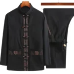 Men's black Tang suit jacket with Fu character embroidery and frog button closure, front view on wooden hanger