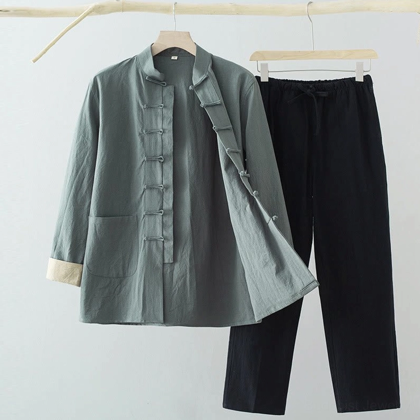 Men's Tang suit two-piece set with gray-green shirt and black pants featuring traditional frog buttons, front view on mannequin