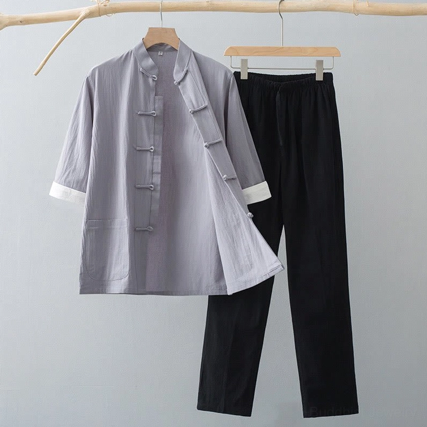 Men's Tang suit set in grey color with traditional frog button top and full-length pants displayed on wooden hanger