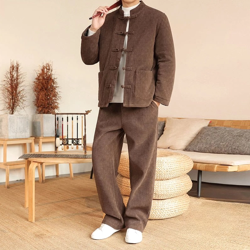 Men's traditional Tang suit jacket and pants, front view detail highlighting handcrafted frog buttons
