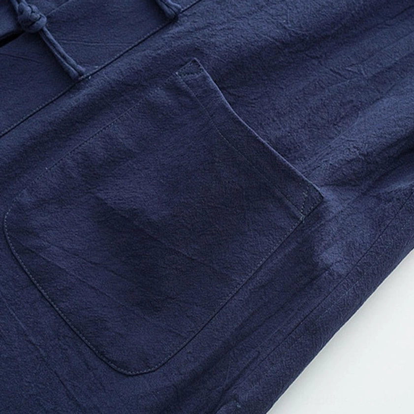 Men's Tang suit handcrafted construction detail showing traditional stitching and fabric quality