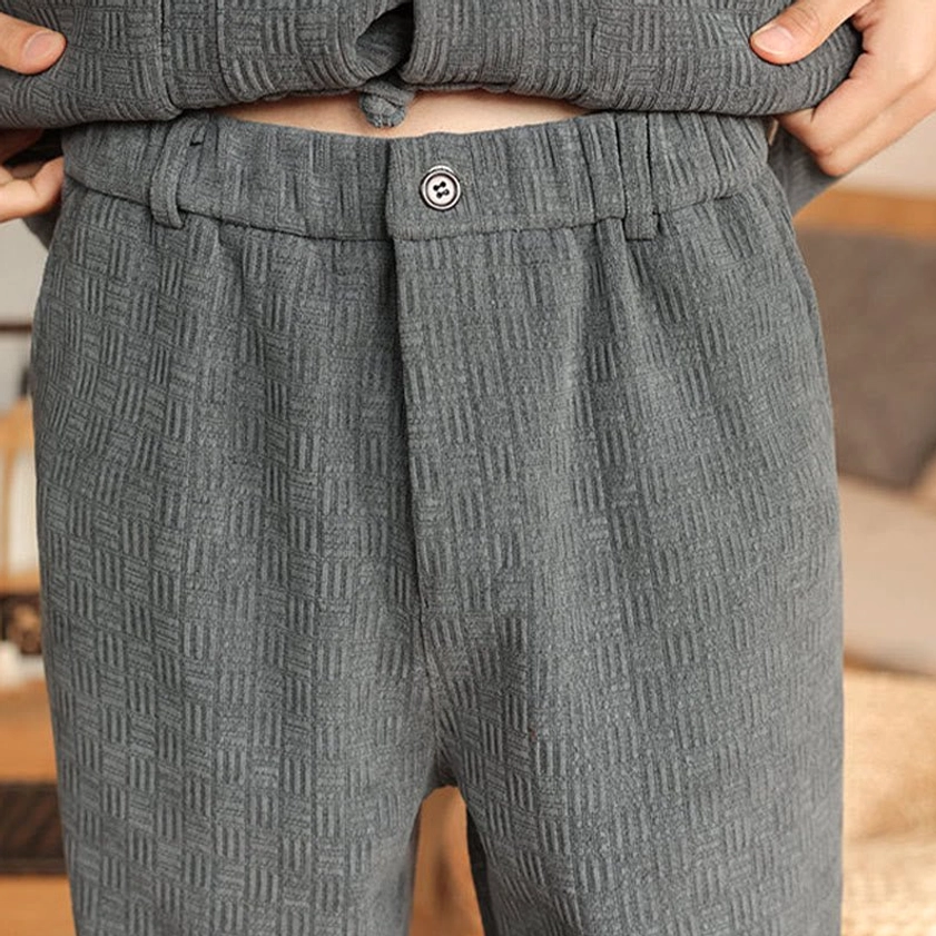 Men's traditional Tang suit cotton padded set, detail shot of jacket pocket and frog button design