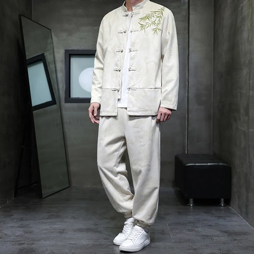 Left front three-quarter view of Tang suit set with side jacket pockets and bamboo chest embroidery