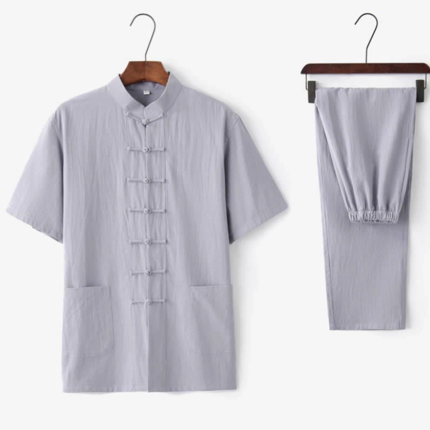 Men's light gray traditional Tang suit set with patch pockets and mandarin collar, complete two-piece ensemble on display