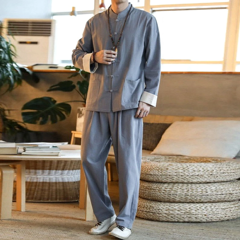Men wearing gray Tang suit with pendant necklace and casual styling for modern Zen aesthetic