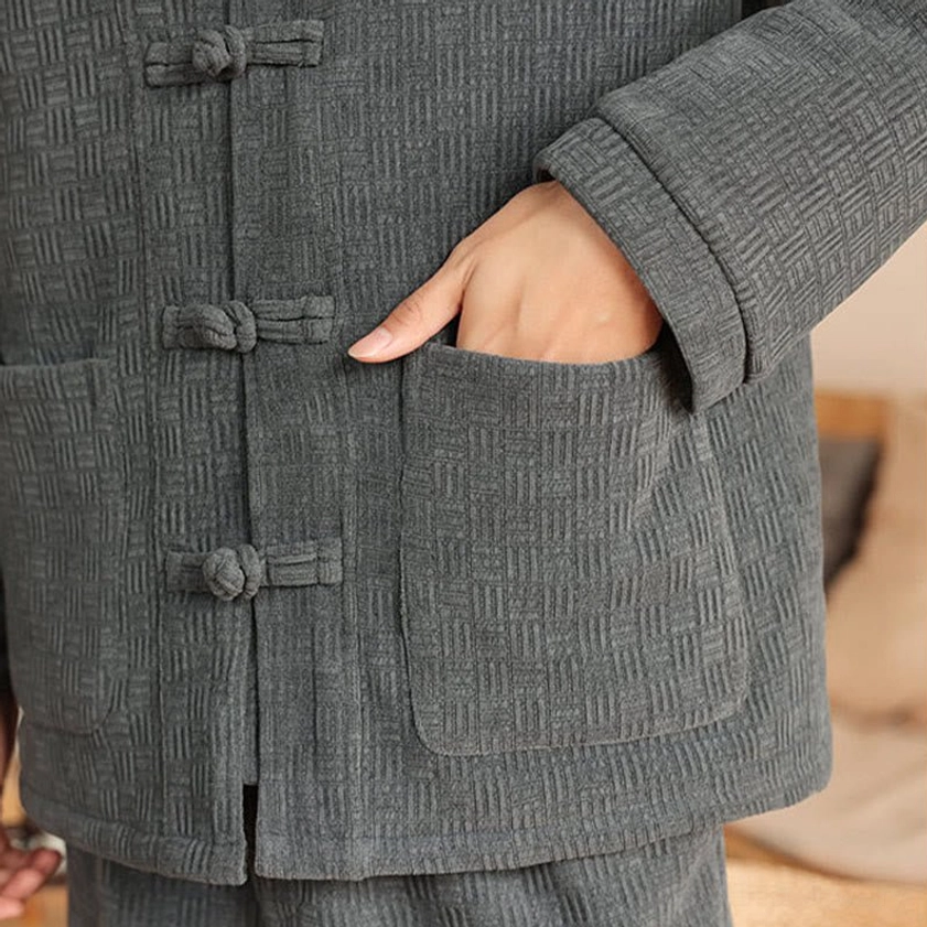 Men's traditional Tang suit two-piece, front view highlighting padded fabric texture and jacket silhouette