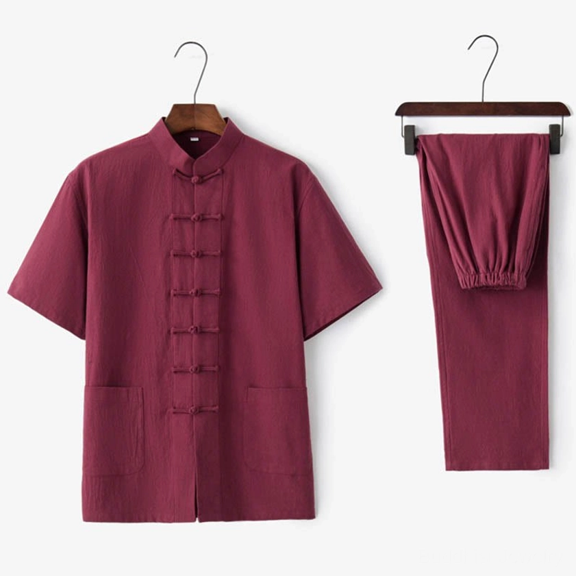 Men's red traditional Tang suit set with frog buttons and matching pants, festive formal attire for celebrations