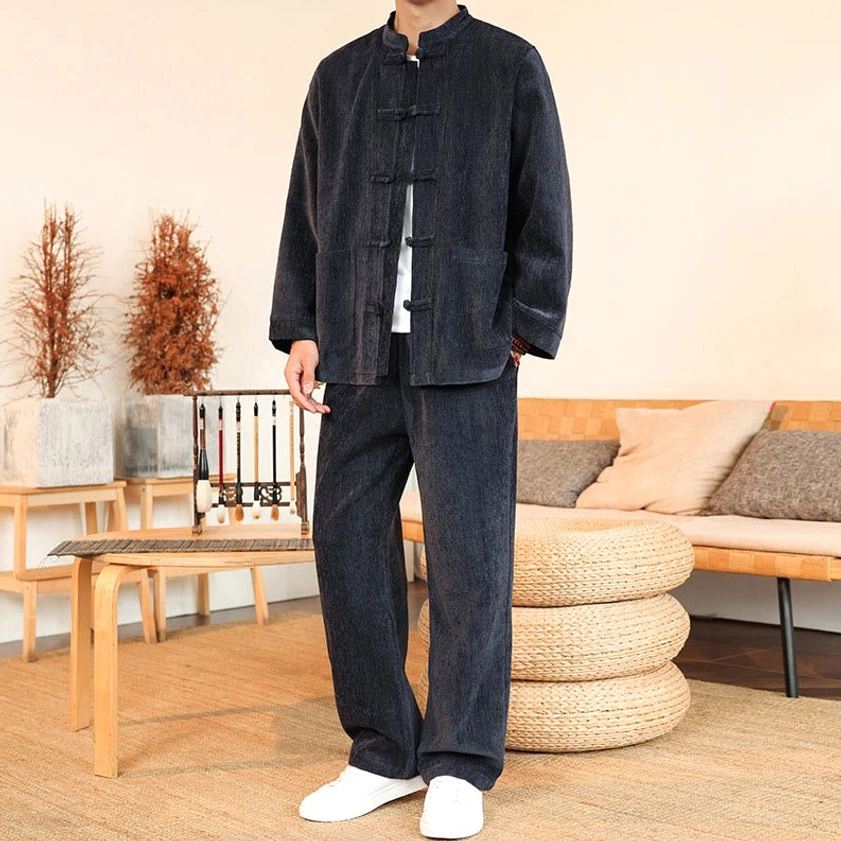 Men's corduroy Tang suit full-body relaxed standing pose in living room setting